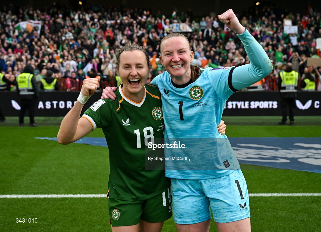 18 April 2026; Kyra Carusa, left, and Republic of Ireland goalkeeper Courtney Brosnan celebrate after the 2027 FIFA Women’s World Cup Qualifier match between Republic of Ireland and Poland at the Aviva Stadium in Dublin. Photo by Stephen McCarthy/Sportsfile