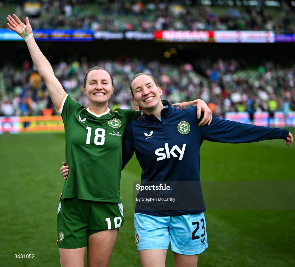 18 April 2026; Kyra Carusa, left, and Republic of Ireland goalkeeper Sophie Whitehouse celebrate after the 2027 FIFA Women’s World Cup Qualifier match between Republic of Ireland and Poland at the Aviva Stadium in Dublin. Photo by Stephen McCarthy/Sportsfile