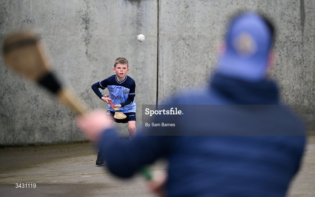 18 April 2026; Dublin supporter Tommy Cullen, aged 10, from Ballyboden in Dublin, pucks a ball with his father Stephen before the Leinster GAA Senior Hurling Championship Round 1 match between Offaly and Dublin at Glenisk O'Connor Park in Tullamore, Offaly. Photo by Sam Barnes/Sportsfile
