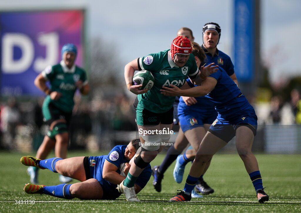 18 April 2026; Aoife Wafer of Ireland is tackled by Vittoria Vecchini and Aura Muzzo of Italy during the Women's Six Nations Rugby Championship match between Ireland and Italy at Dexcom Stadium in Galway. Photo by Brendan Moran/Sportsfile