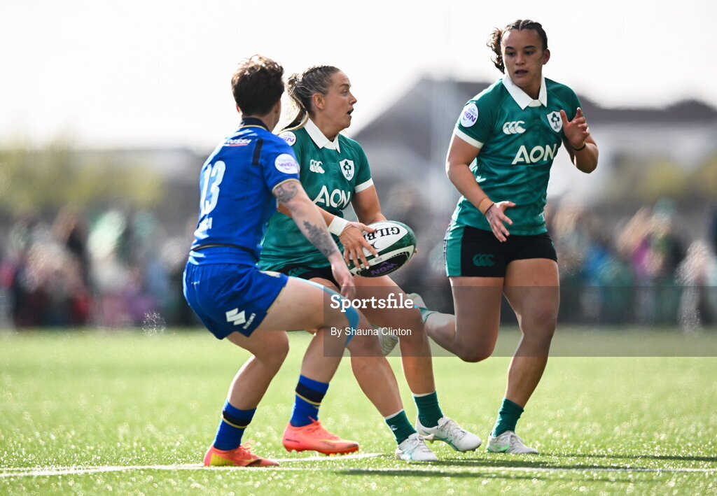 18 April 2026; Stacey Flood of Ireland offloads to Nancy McGillivray during the Women's Six Nations Rugby Championship match between Ireland and Italy at Dexcom Stadium in Galway. Photo by Shauna Clinton/Sportsfile