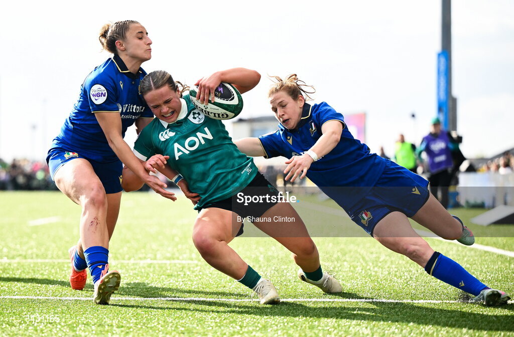 18 April 2026; Robyn O'Connor of Ireland scores her side's fourth try despite the efforts of Sara Mannini, left, and Gaia Buso of Italy during the Women's Six Nations Rugby Championship match between Ireland and Italy at Dexcom Stadium in Galway. Photo by Shauna Clinton/Sportsfile