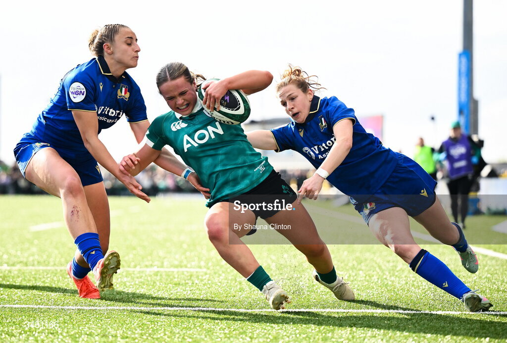 18 April 2026; Robyn O'Connor of Ireland scores her side's fourth try despite the efforts of Sara Mannini, left, and Gaia Buso of Italy during the Women's Six Nations Rugby Championship match between Ireland and Italy at Dexcom Stadium in Galway. Photo by Shauna Clinton/Sportsfile