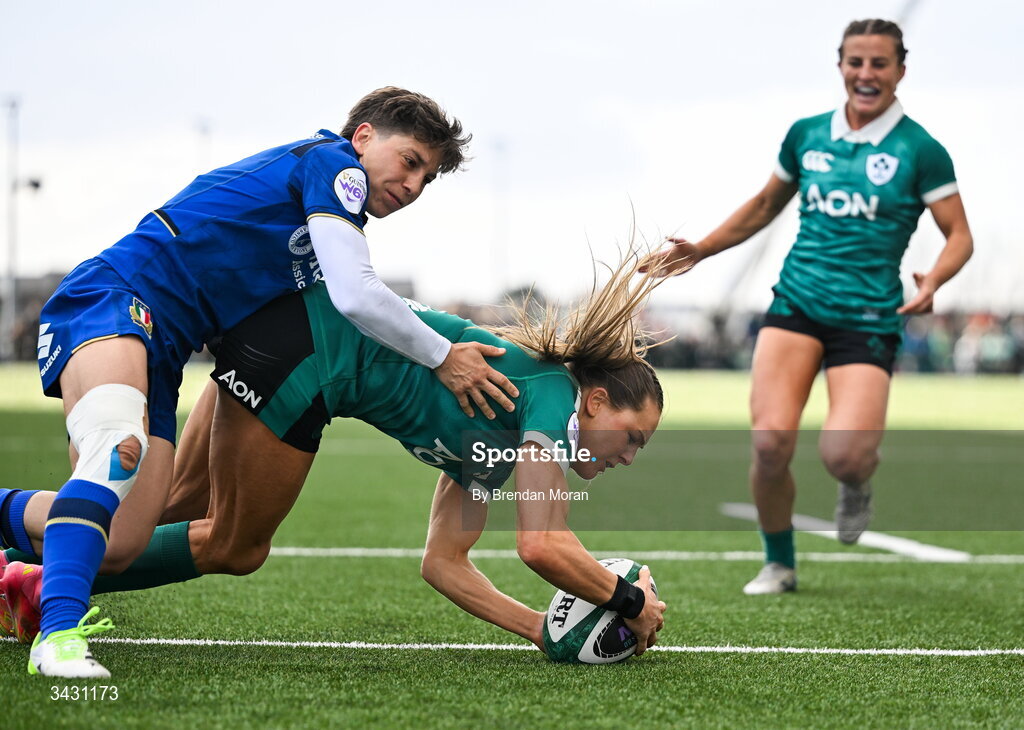 18 April 2026; Béibhinn Parsons of Ireland scores her second try despite the tackle of Sofia Stefan of Italy during the Women's Six Nations Rugby Championship match between Ireland and Italy at Dexcom Stadium in Galway. Photo by Brendan Moran/Sportsfile
