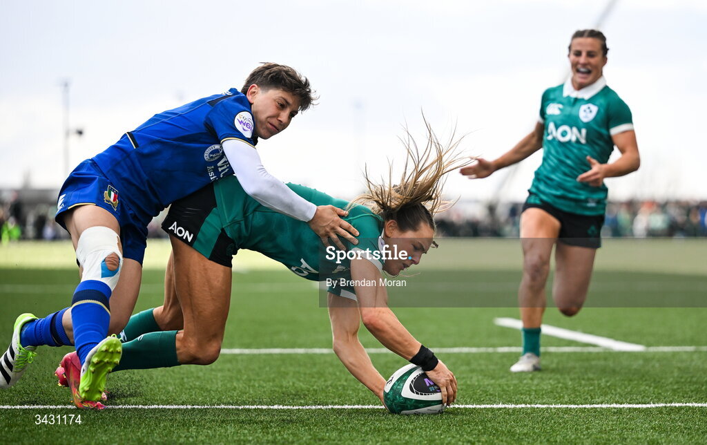18 April 2026; Béibhinn Parsons of Ireland scores her second try despite the tackle of Sofia Stefan of Italy during the Women's Six Nations Rugby Championship match between Ireland and Italy at Dexcom Stadium in Galway. Photo by Brendan Moran/Sportsfile