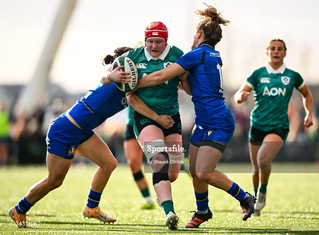 18 April 2026; Aoife Wafer of Ireland is tackled by Emma Stevanin, left, and Aura Muzzo of Italy during the Women's Six Nations Rugby Championship match between Ireland and Italy at Dexcom Stadium in Galway. Photo by Shauna Clinton/Sportsfile