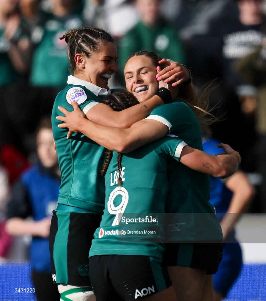 18 April 2026; Béibhinn Parsons of Ireland, right, celebrates with teammates Erin King and Emily Lane after scoring her thurd try during the Women's Six Nations Rugby Championship match between Ireland and Italy at Dexcom Stadium in Galway. Photo by Brendan Moran/Sportsfile