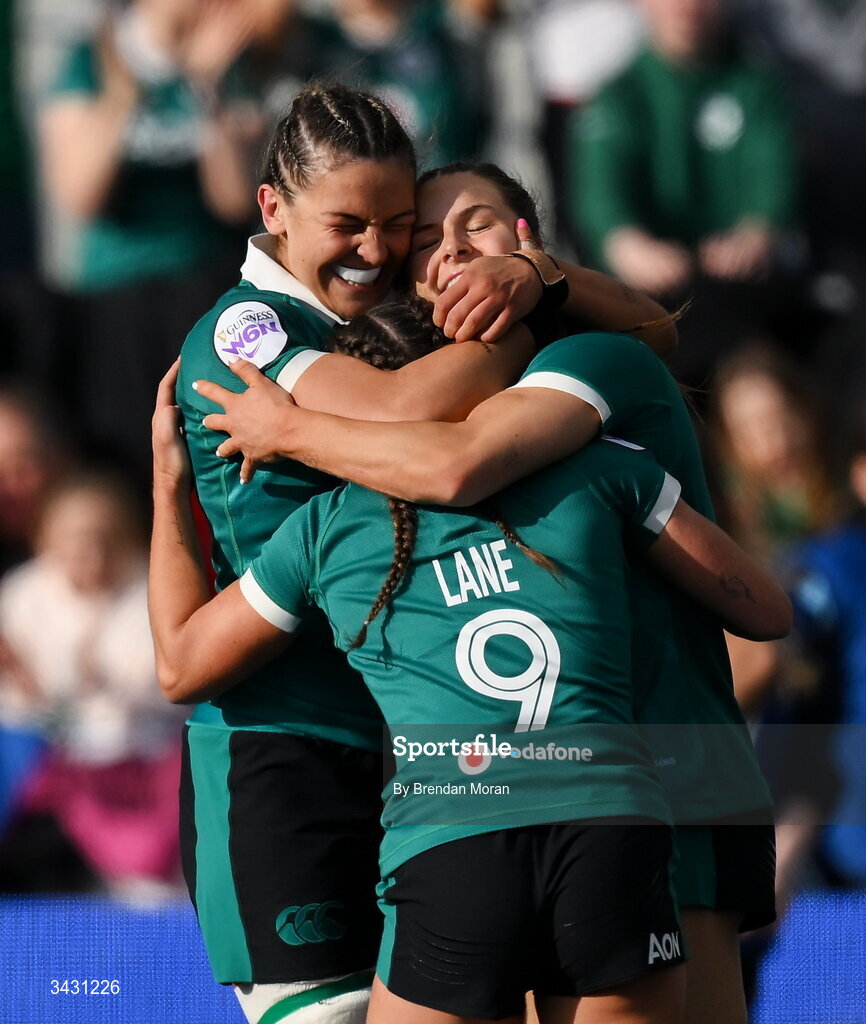 18 April 2026; Béibhinn Parsons of Ireland, right, celebrates with teammates Erin King and Emily Lane after scoring her thurd try during the Women's Six Nations Rugby Championship match between Ireland and Italy at Dexcom Stadium in Galway. Photo by Brendan Moran/Sportsfile