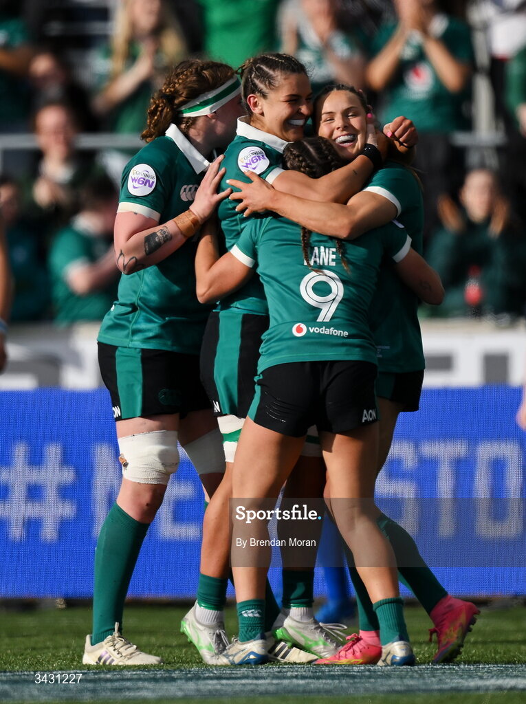 18 April 2026; Béibhinn Parsons of Ireland, right, celebrates with teammates Ruth Campbell, Erin King and Emily Lane after scoring her thurd try during the Women's Six Nations Rugby Championship match between Ireland and Italy at Dexcom Stadium in Galway. Photo by Brendan Moran/Sportsfile