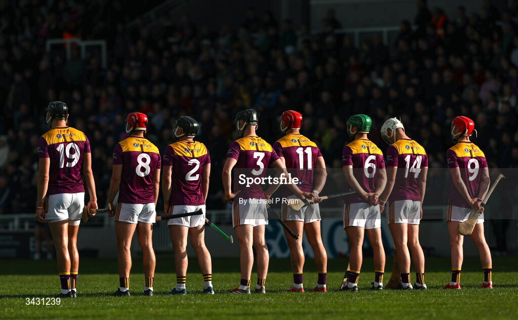 18 April 2026; Wexford players stand for the playing of Amhrán na bhFiann before the Leinster GAA Senior Hurling Championship Round 1 match between Kildare and Wexford at Cedral St Conleth's Park in Newbridge, Kildare. Photo by Michael P Ryan/Sportsfile