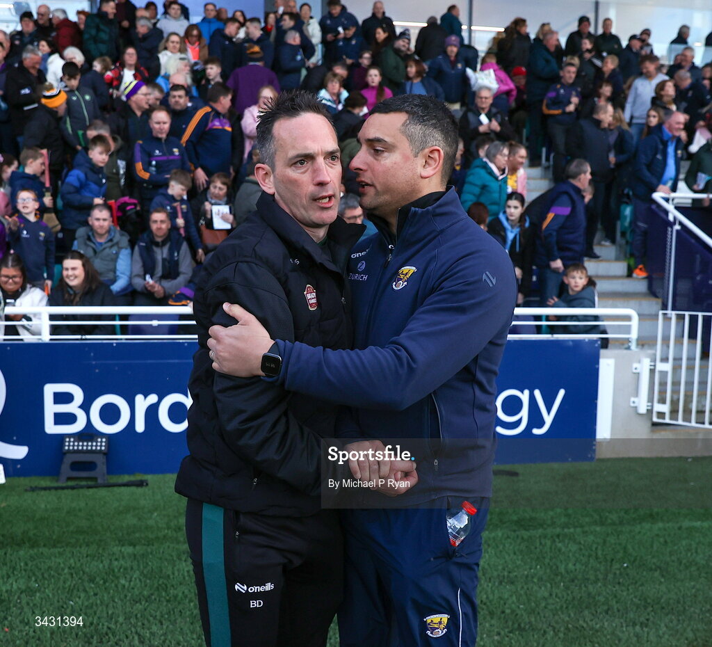 18 April 2026; Kildare manager Brian Dowling, left, shakes hands with Wexford manager Keith Rossiter after the Leinster GAA Senior Hurling Championship Round 1 match between Kildare and Wexford at Cedral St Conleth's Park in Newbridge, Kildare. Photo by Michael P Ryan/Sportsfile