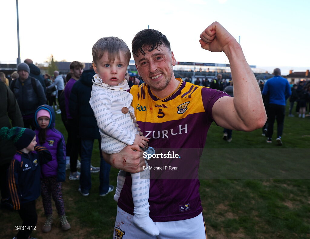 18 April 2026; Damien Reck of Wexford with his 18 month old son Ruairí, after the Leinster GAA Senior Hurling Championship Round 1 match between Kildare and Wexford at Cedral St Conleth's Park in Newbridge, Kildare. Photo by Michael P Ryan/Sportsfile