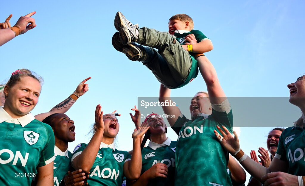 18 April 2026; Sam Monaghan of Ireland, centre, celebrates with Bert, son of team-mate Ellena Perry, and team-mates after their side's victory in the Women's Six Nations Rugby Championship match between Ireland and Italy at Dexcom Stadium in Galway. Photo by Shauna Clinton/Sportsfile