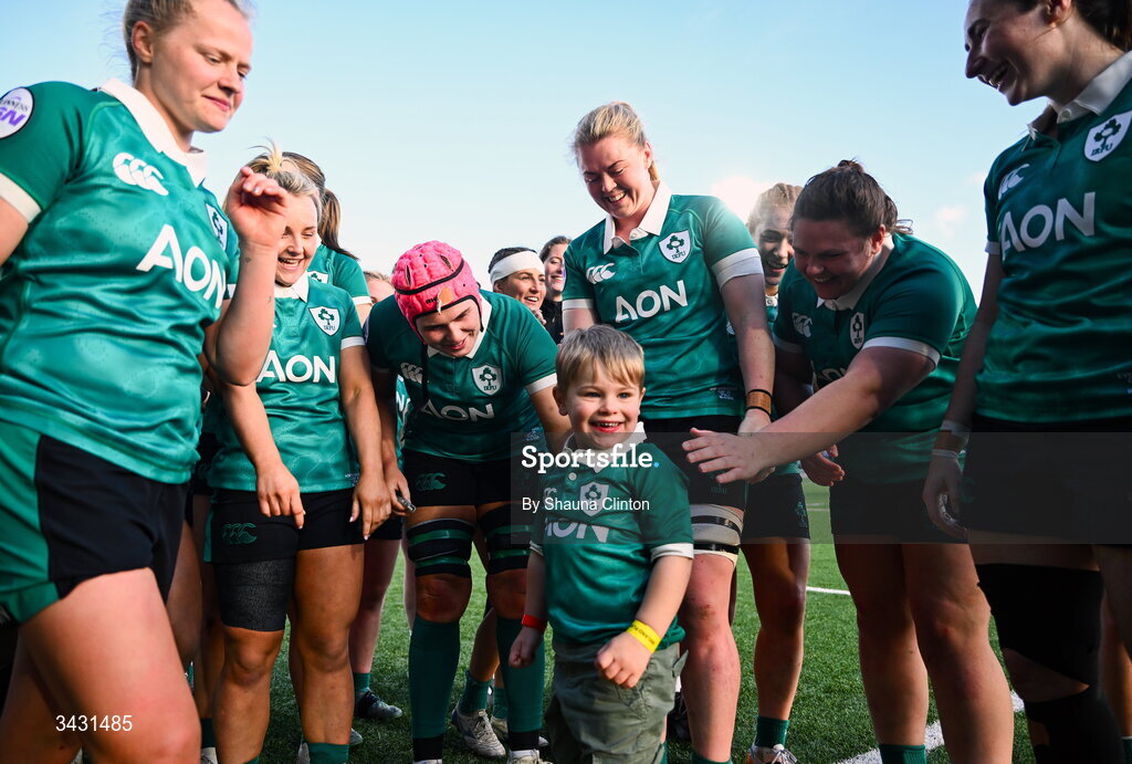 18 April 2026; Sam Monaghan of Ireland, centre, celebrates with Bert, son of team-mate Ellena Perry, and team-mates after their side's victory in the Women's Six Nations Rugby Championship match between Ireland and Italy at Dexcom Stadium in Galway. Photo by Shauna Clinton/Sportsfile