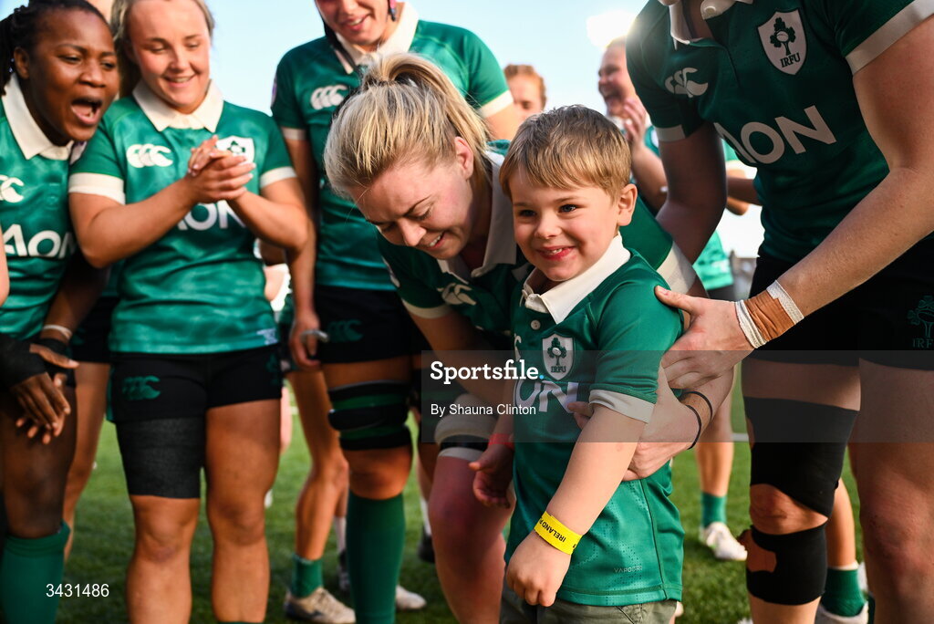 18 April 2026; Sam Monaghan of Ireland, centre, celebrates with Bert, son of team-mate Ellena Perry, and team-mates after their side's victory in the Women's Six Nations Rugby Championship match between Ireland and Italy at Dexcom Stadium in Galway. Photo by Shauna Clinton/Sportsfile
