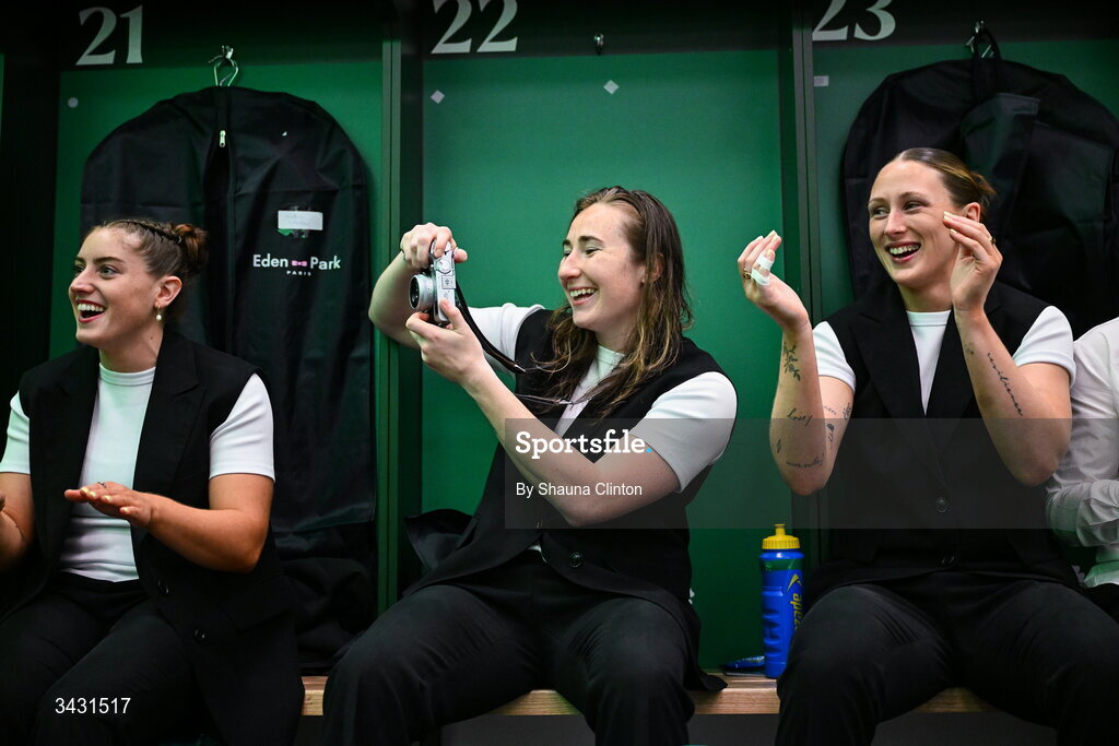 18 April 2026; Ireland players, from left, Katie Whelan, Eve Higgins and Anna McGann sing along with team-mate Robyn O'Connor, not pictured, after being presented with her first international cap in the Women's Six Nations Rugby Championship match between Ireland and Italy at Dexcom Stadium in Galway. Photo by Shauna Clinton/Sportsfile