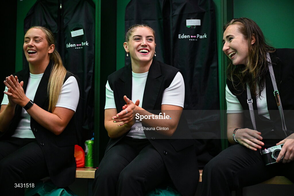 18 April 2026; Ireland players, from left, Stacey Flood, Katie Whelan and Eve Higgins, sing along with team-mate Robyn O'Connor, not pictured, after being presented with her first international cap in the Women's Six Nations Rugby Championship match between Ireland and Scotland at Dexcom Stadium in Galway. Photo by Shauna Clinton/Sportsfile Photo by Shauna Clinton/Sportsfile