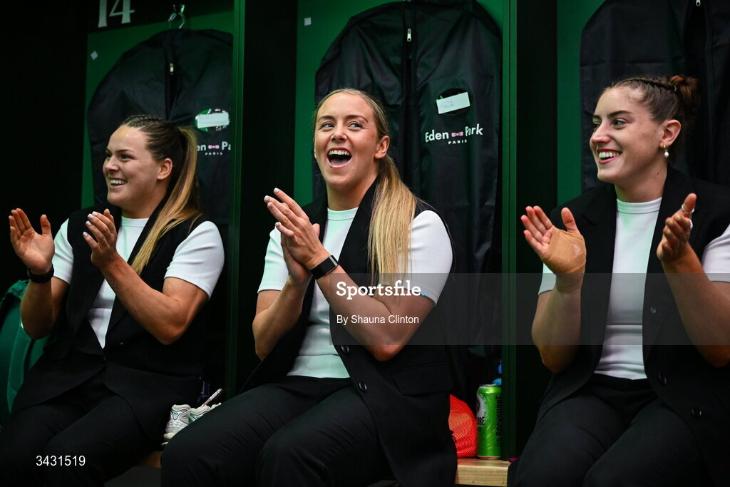 18 April 2026; Ireland players, from left, Béibhinn Parsons, Stacey Flood and Katie Whelan sing along with team-mate Robyn O'Connor, not pictured, after being presented with her first international cap in the Women's Six Nations Rugby Championship match between Ireland and Scotland at Dexcom Stadium in Galway. Photo by Shauna Clinton/Sportsfile Photo by Shauna Clinton/Sportsfile