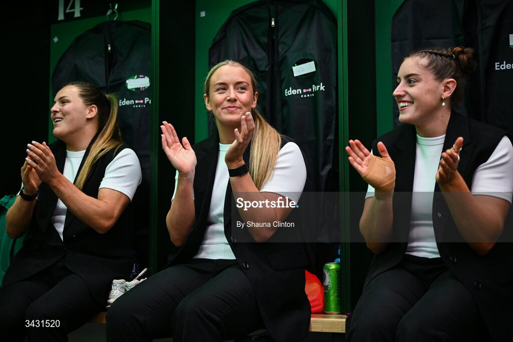 18 April 2026; Ireland players, from left, Béibhinn Parsons, Stacey Flood and Katie Whelan, sing along with team-mate Robyn O'Connor, not pictured, after being presented with her first international cap in the Women's Six Nations Rugby Championship match between Ireland and Italy at Dexcom Stadium in Galway. Photo by Shauna Clinton/Sportsfile