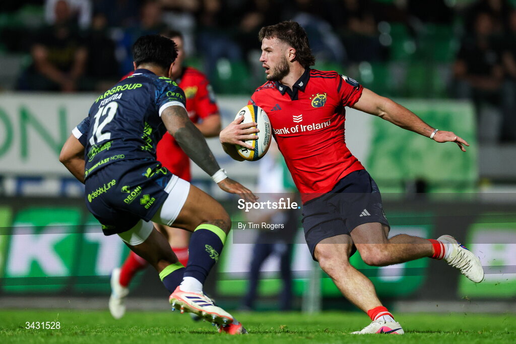 18 April 2026; Alex Nankivell of Munster takes on Malakai Fekitoa of Benetton during the United Rugby Championship match between Benetton and Munster at Stadio Monigo in Treviso, Italy. Photo by Tim Rogers/Sportsfile