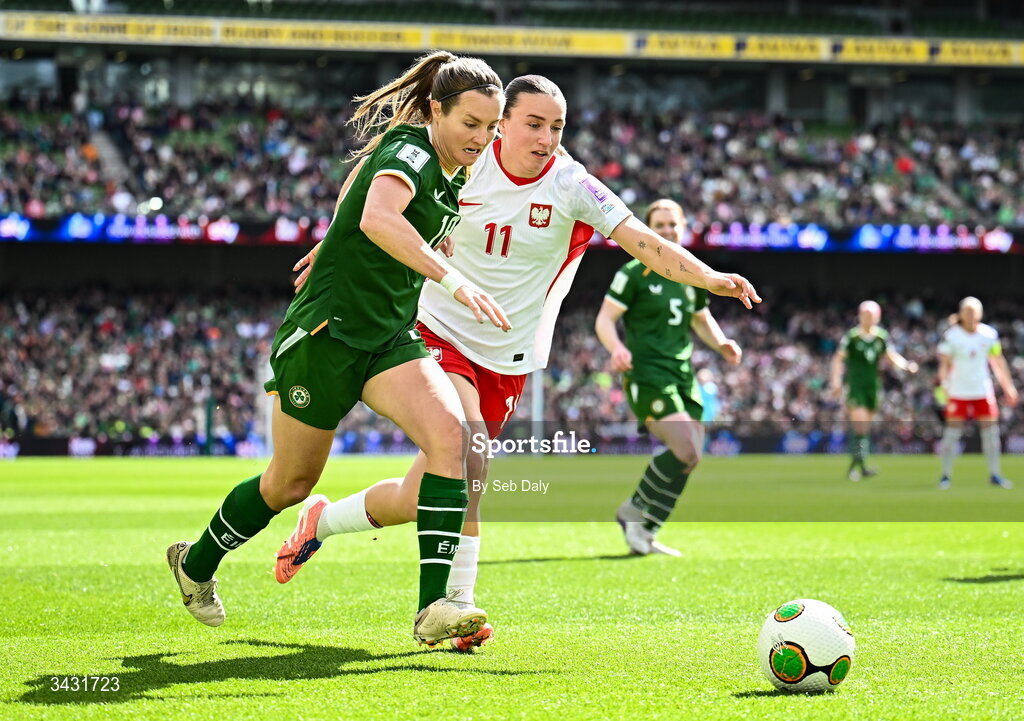 18 April 2026; Kyra Carusa of Republic of Ireland in action against Tanja Pawollek of Poland during the 2027 FIFA Women’s World Cup Qualifier match between Republic of Ireland and Poland at the Aviva Stadium in Dublin. Photo by Seb Daly/Sportsfile