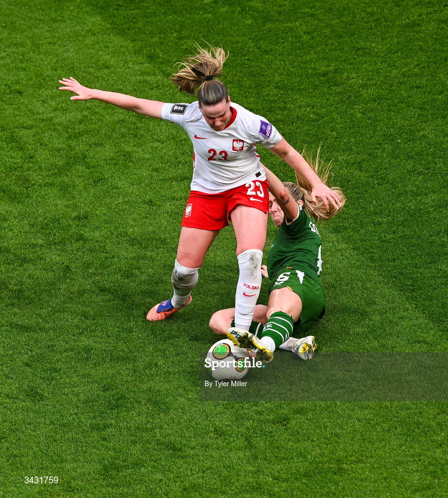 18 April 2026; Adriana Achcinska of Poland is tackled by Megan Connolly of Republic of Ireland during the 2027 FIFA Women’s World Cup Qualifier match between Republic of Ireland and Poland at the Aviva Stadium in Dublin. Photo by Tyler Miller/Sportsfile