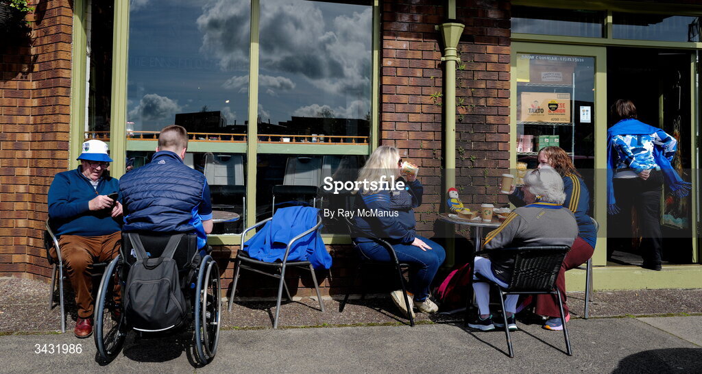 19 April 2026; Supporters of Waterford, left, and Clare, relax, outside The Food Emporium, Francis Street, before the Munster GAA Senior Hurling Championship Round 1 match between Clare and Waterford at Zimmer Biomet Páirc Chíosóg in Ennis, Clare. Photo by Ray McManus/Sportsfile