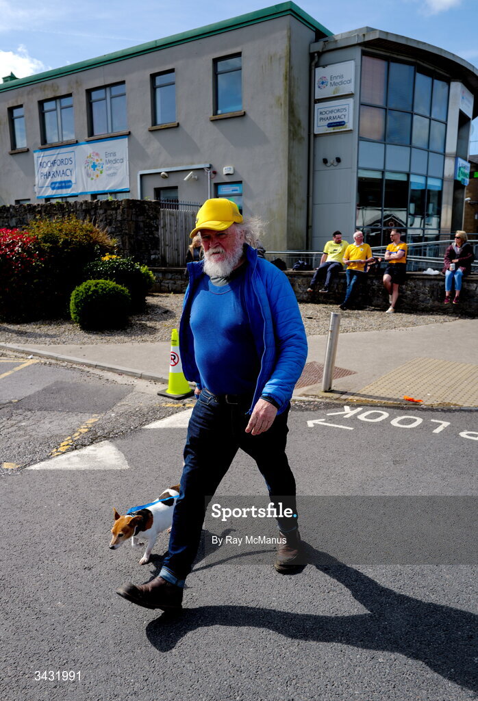 19 April 2026;S A Clare supporter walks his dog along Francis Street before the Munster GAA Senior Hurling Championship Round 1 match between Clare and Waterford at Zimmer Biomet Páirc Chíosóg in Ennis, Clare. Photo by Ray McManus/Sportsfile