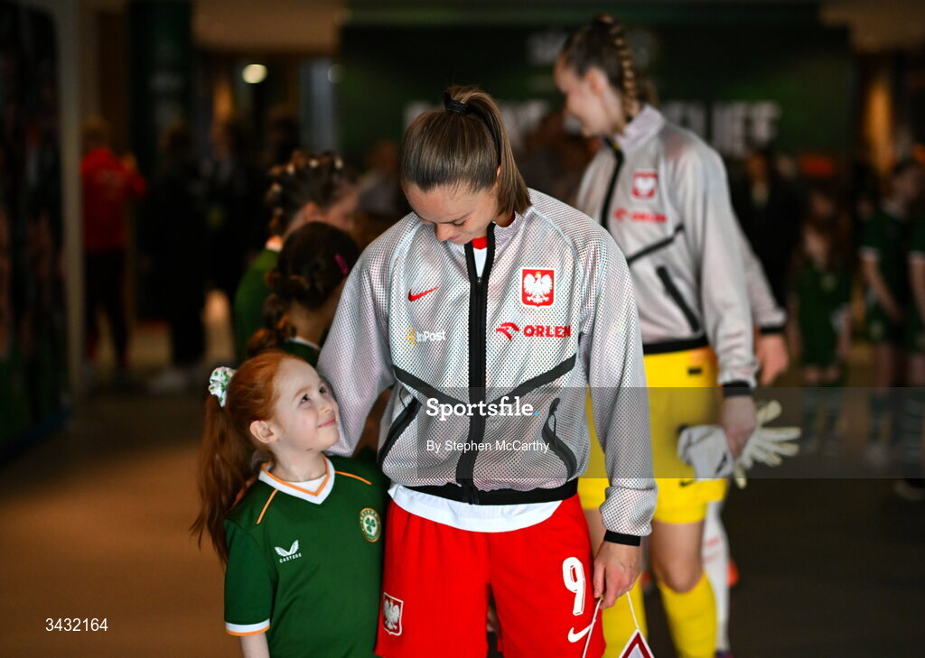 18 April 2026; Poland captain Ewa Pajor and mascot Millie Byrne before the 2027 FIFA Women’s World Cup Qualifier match between Republic of Ireland and Poland at the Aviva Stadium in Dublin. Photo by Stephen McCarthy/Sportsfile