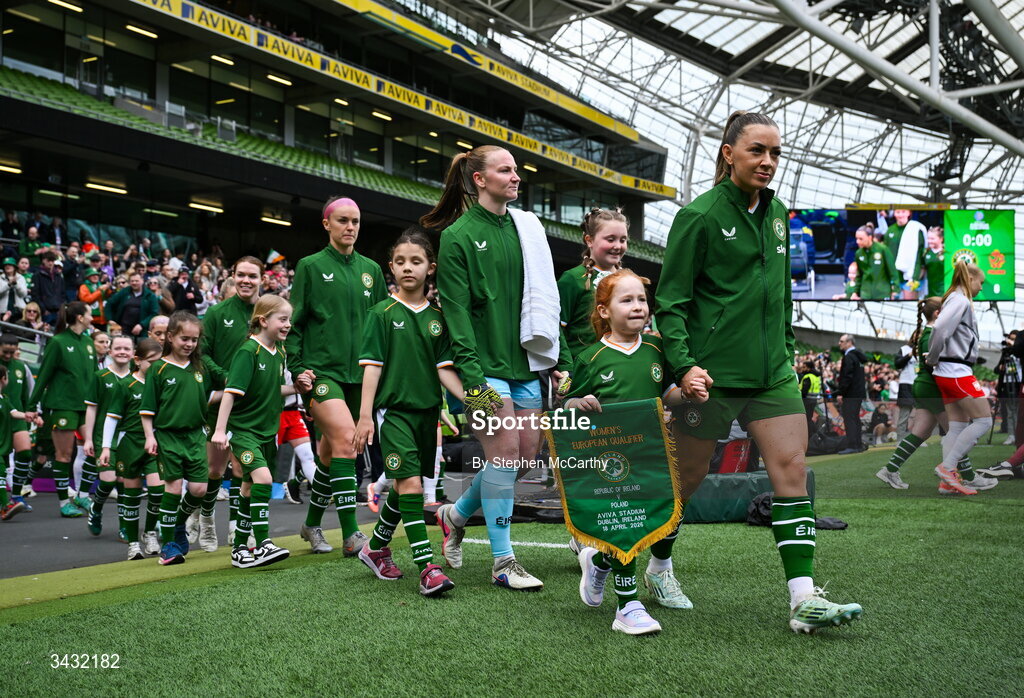 18 April 2026; Republic of Ireland captain Katie McCabe and mascot Millie Byrne lead the team out before the 2027 FIFA Women’s World Cup Qualifier match between Republic of Ireland and Poland at the Aviva Stadium in Dublin. Photo by Stephen McCarthy/Sportsfile