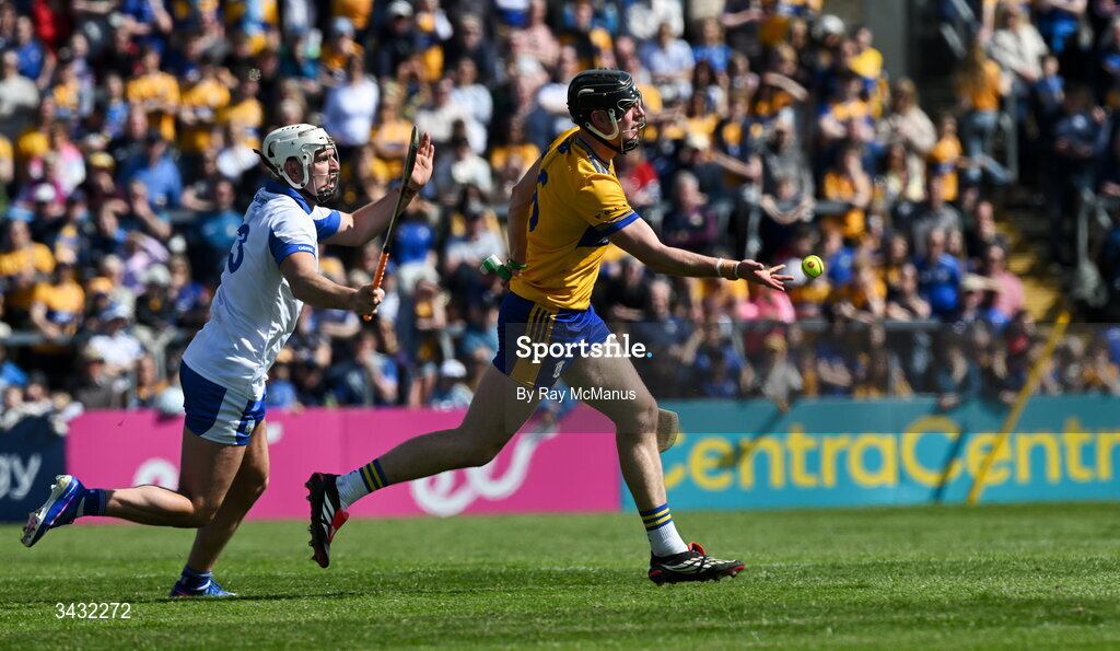 19 April 2026; Niall O'Farrell of Clare is tackled by Dessie Hutchinson of Waterford during the Munster GAA Senior Hurling Championship Round 1 match between Clare and Waterford at Zimmer Biomet Páirc Chíosóg in Ennis, Clare. Photo by Ray McManus/Sportsfile