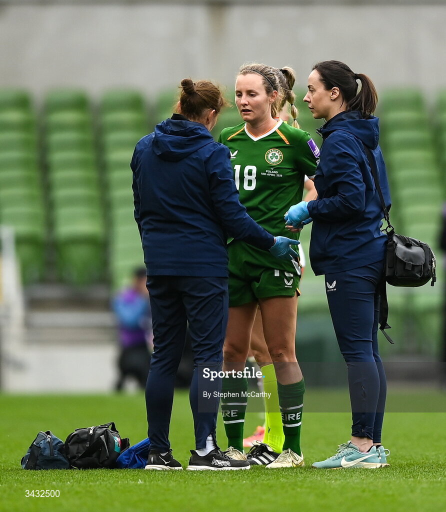 18 April 2026; Kyra Carusa of Republic of Ireland receives medical attention from Dr Siobhan Forman, team doctor; left, and physiotherapist Angela Kenneally, right, during the 2027 FIFA Women’s World Cup Qualifier match between Republic of Ireland and Poland at the Aviva Stadium in Dublin. Photo by Stephen McCarthy/Sportsfile