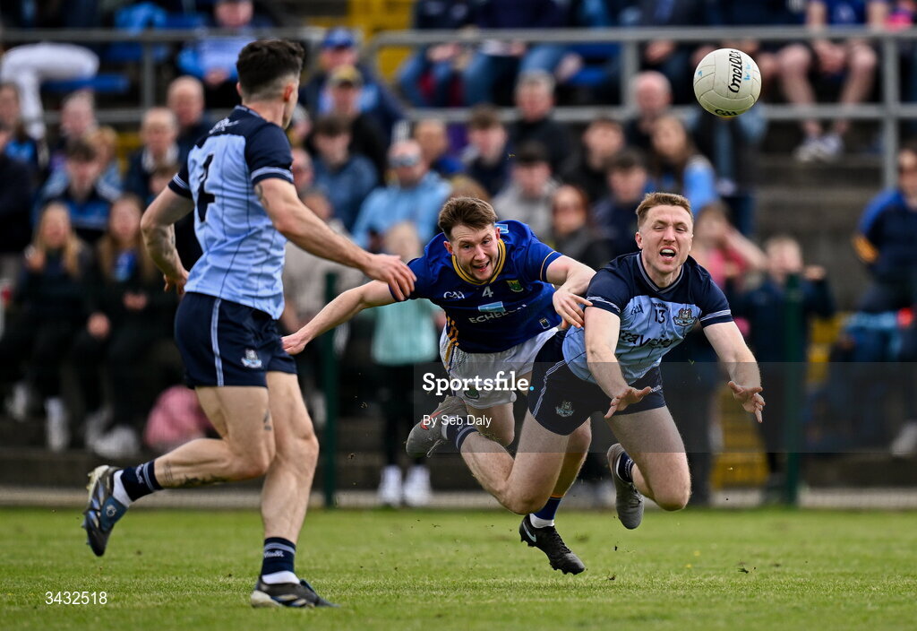 19 April 2026; Paddy Small of Dublin is tackled by Gavin Fogarty of Wicklow as he passes to teammate David Byrne during the Leinster GAA Football Senior Championship quarter-final match between Wicklow and Dublin at Echelon Park in Aughrim in Wicklow. Photo by Seb Daly/Sportsfile
