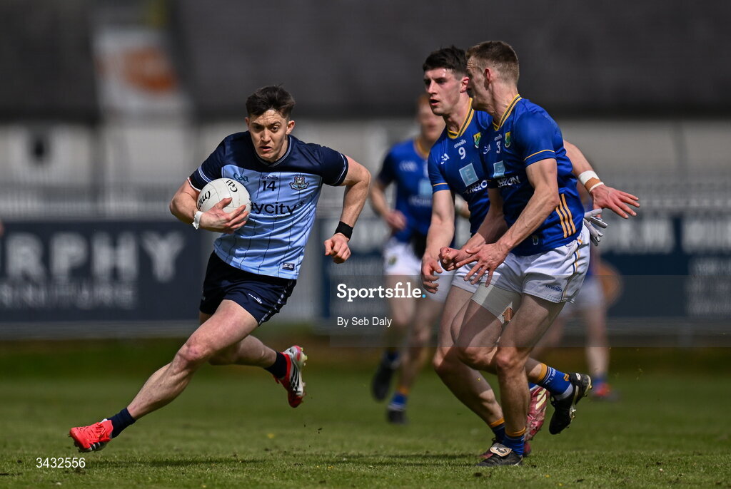 19 April 2026; Killian McGinnis of Dublin in action against Wicklow players Jack Kirwan and Conall Ó Gallchobhair during the Leinster GAA Football Senior Championship quarter-final match between Wicklow and Dublin at Echelon Park in Aughrim in Wicklow. Photo by Seb Daly/Sportsfile