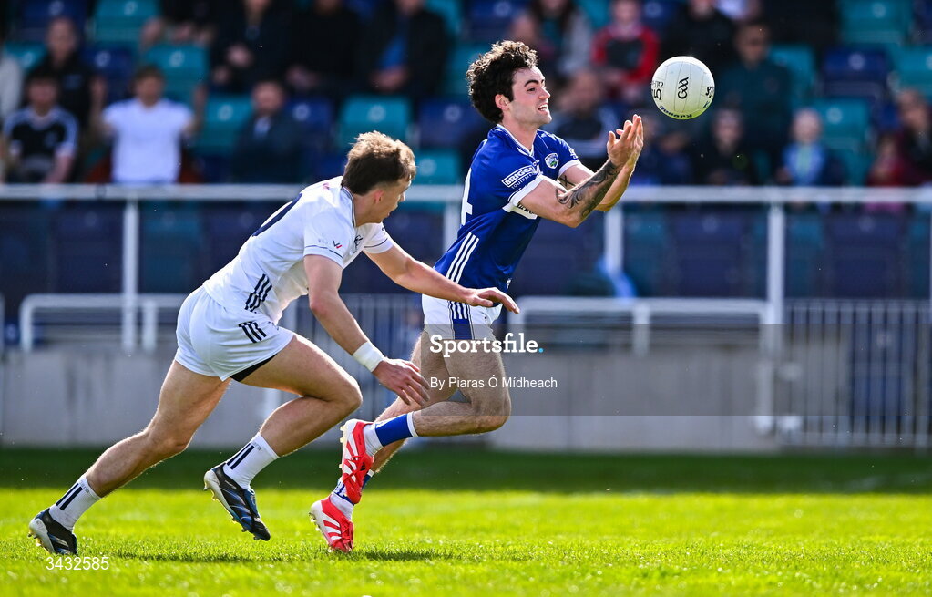19 April 2026; Daragh Galvin of Laois scores a point under pressure from Brian McLoughlin of Kildare during the Leinster GAA Football Senior Championship quarter-final match between Kildare and Laois at Cedral St Conleths Park in Newbridge, Kildare. Photo by Piaras Ó Mídheach/Sportsfile