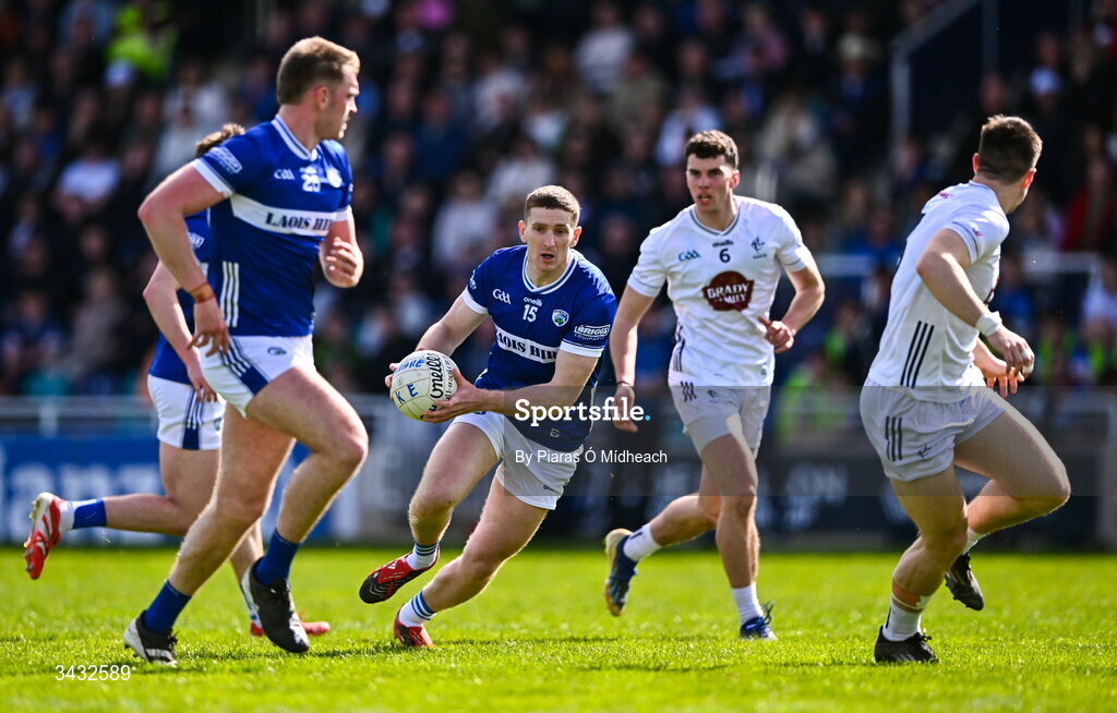 19 April 2026; Evan O'Carroll of Laois gets away from Eoin Lawlor of Kildare, 6, during the Leinster GAA Football Senior Championship quarter-final match between Kildare and Laois at Cedral St Conleths Park in Newbridge, Kildare. Photo by Piaras Ó Mídheach/Sportsfile