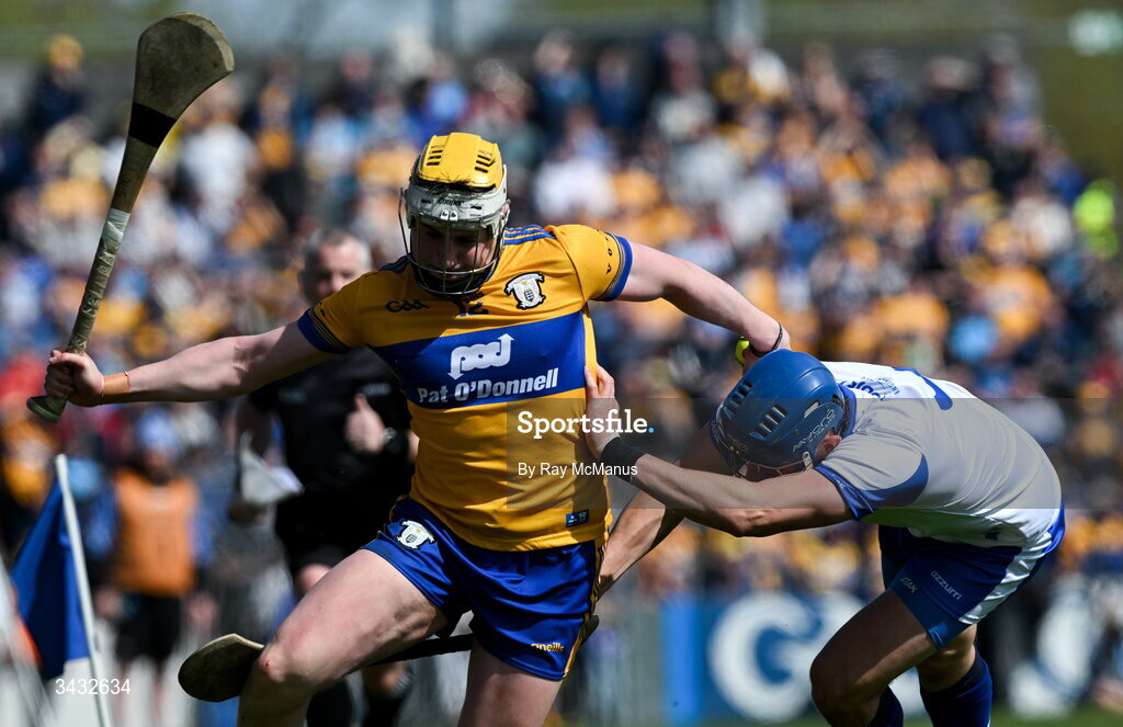 19 April 2026; Sean Rynne of Clare is tackled by Paddy Leavey of Waterford during the Munster GAA Senior Hurling Championship Round 1 match between Clare and Waterford at Zimmer Biomet Páirc Chíosóg in Ennis, Clare. Photo by Ray McManus/Sportsfile