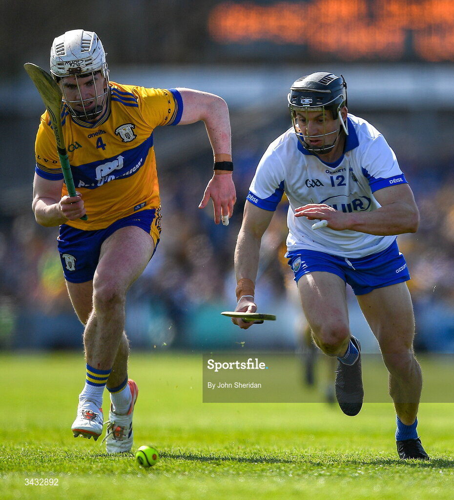 19 April 2026; Adam Hogan of Clare in action against Jamie Barron of Waterford during the Munster GAA Senior Hurling Championship Round 1 match between Clare and Waterford at Zimmer Biomet Páirc Chíosóg in Ennis, Clare. Photo by John Sheridan/Sportsfile