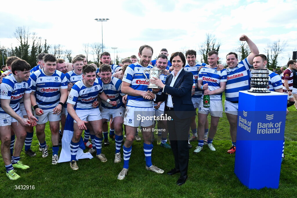 19 April 2026; Craig Miller captain of Athy RFC is presenteded with the cup by Leinster president Moira Flahive after the Bank of Ireland Provincial Towns Cup Final match between Athy RFC and Tullow RFC at Edenderry RFC in Edenderry, Offaly. Photo by Matt Browne/Sportsfile