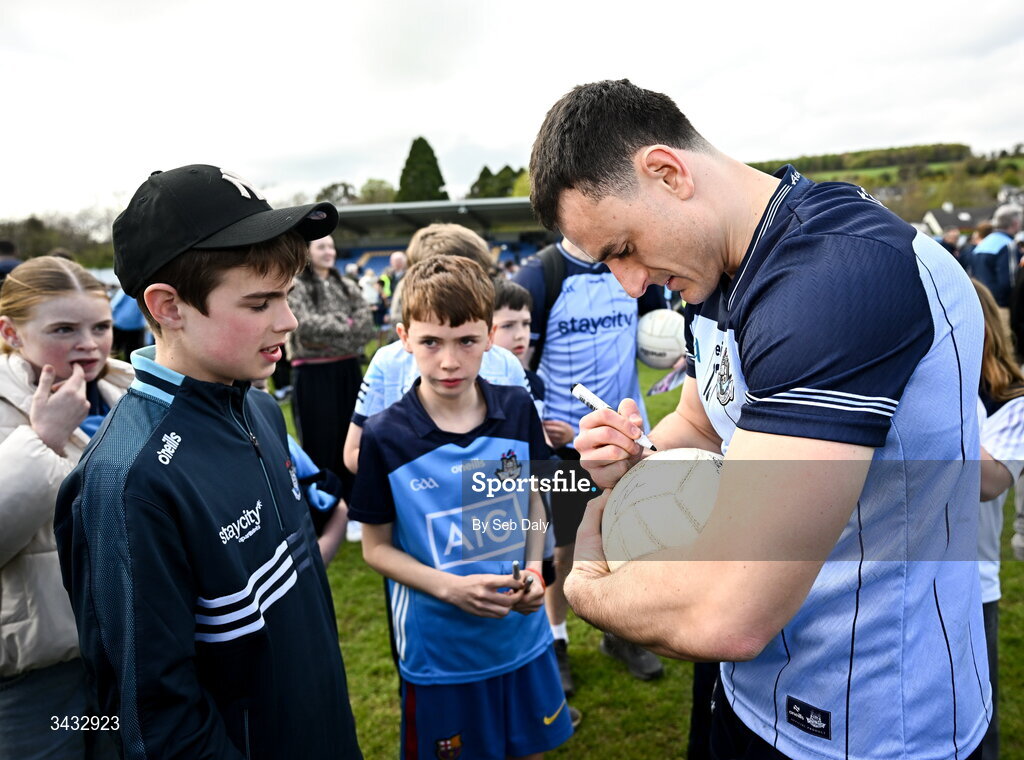 19 April 2026; Páidí White of Dublin signs a football for a supporter after the Leinster GAA Football Senior Championship quarter-final match between Wicklow and Dublin at Echelon Park in Aughrim in Wicklow. Photo by Seb Daly/Sportsfile
