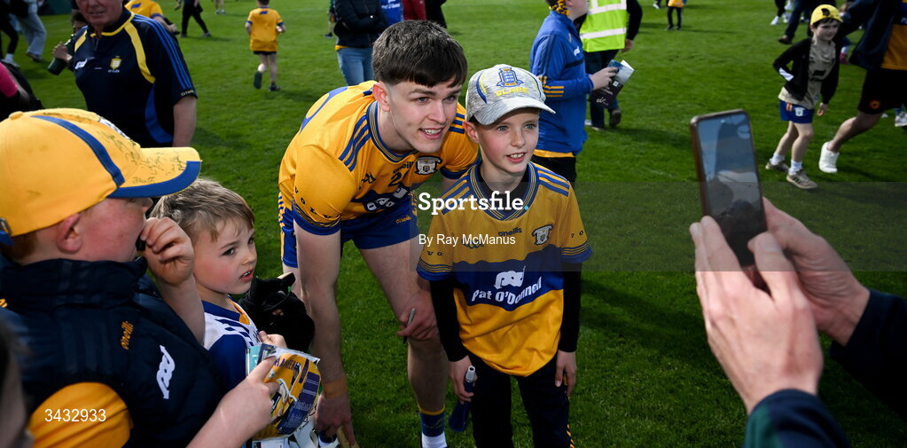 19 April 2026; Cian Galvin of Clare with a young supporter after the Munster GAA Senior Hurling Championship Round 1 match between Clare and Waterford at Zimmer Biomet Páirc Chíosóg in Ennis, Clare. Photo by Ray McManus/Sportsfile