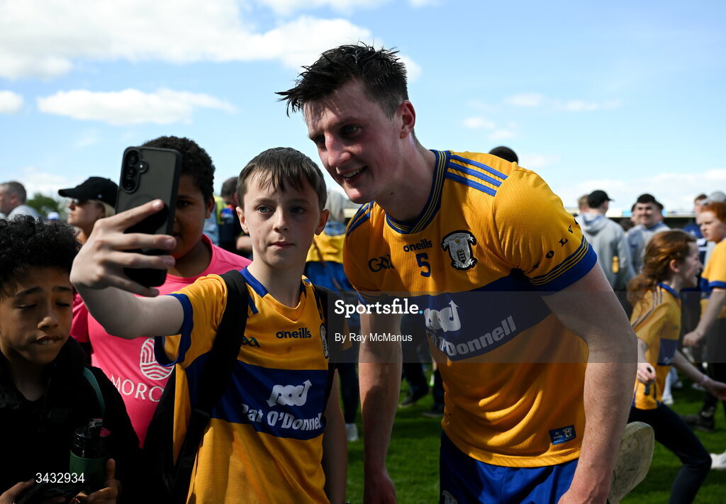 19 April 2026; Diarmuid Ryan of Clare with a young supporter after the Munster GAA Senior Hurling Championship Round 1 match between Clare and Waterford at Zimmer Biomet Páirc Chíosóg in Ennis, Clare. Photo by Ray McManus/Sportsfile