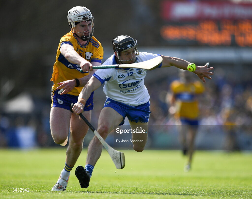 19 April 2026; Adam Hogan of Clare in action against Jamie Barron of Waterford during the Munster GAA Senior Hurling Championship Round 1 match between Clare and Waterford at Zimmer Biomet Páirc Chíosóg in Ennis, Clare. Photo by John Sheridan/Sportsfile