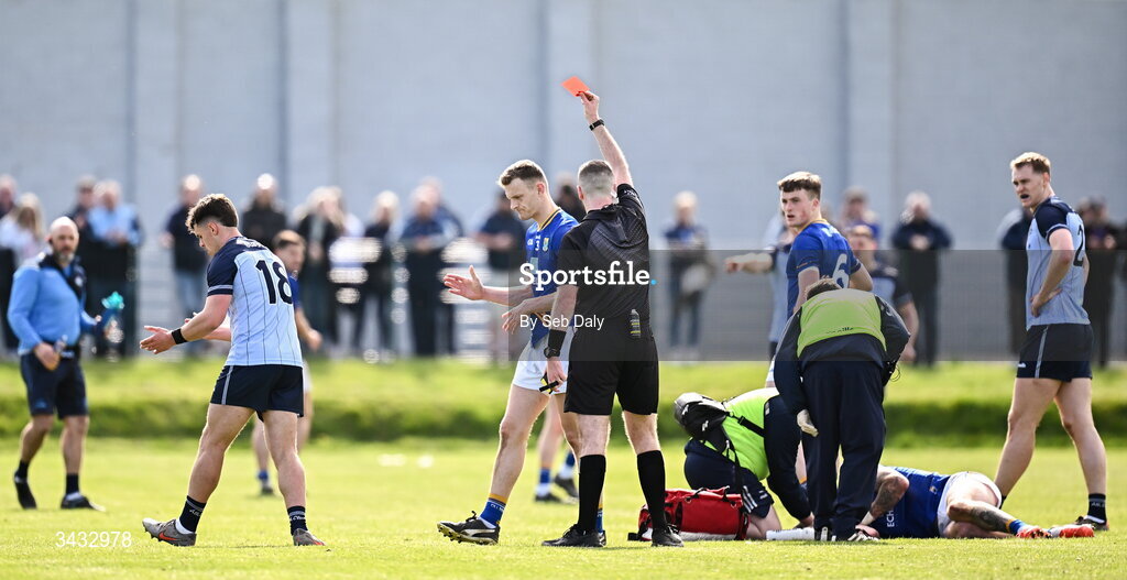 19 April 2026; Referee Conor Dourneen shows a red card to Liam Smith of Dublin, left, during the Leinster GAA Football Senior Championship quarter-final match between Wicklow and Dublin at Echelon Park in Aughrim in Wicklow. Photo by Seb Daly/Sportsfile