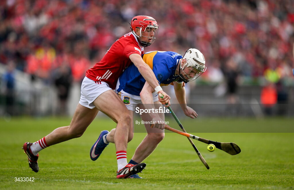 19 April 2026; Oisin O'Donoghue of Tipperary is tackled by Ciarán Joyce of Cork during the Munster GAA Senior Hurling Championship Round 1 match between Tipperary and Cork at FBD Semple Stadium in Thurles, Tipperary. Photo by Brendan Moran/Sportsfile