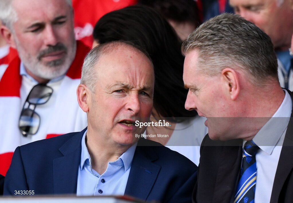 19 April 2026; An Taoiseach Micheál Martin TD in conversation with Munster Council chair Tim Murphy during the Munster GAA Senior Hurling Championship Round 1 match between Tipperary and Cork at FBD Semple Stadium in Thurles, Tipperary. Photo by Brendan Moran/Sportsfile