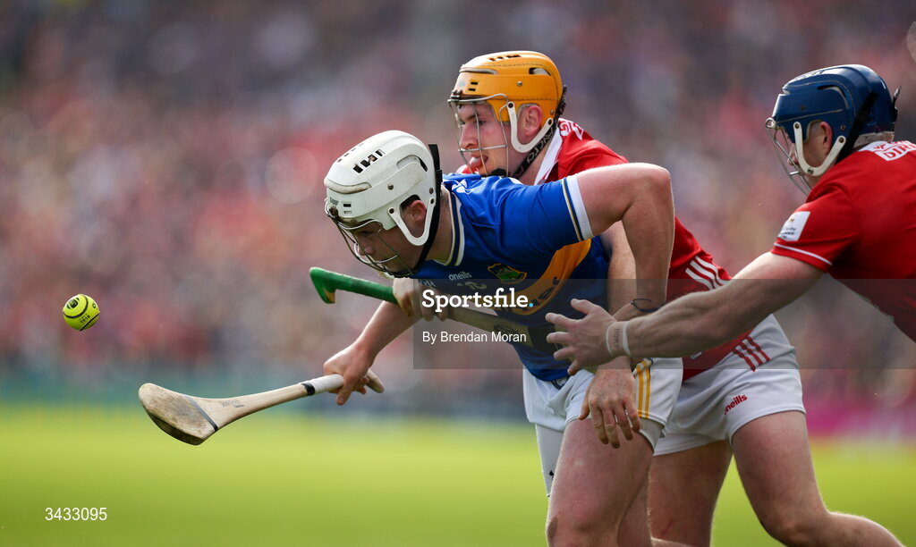 19 April 2026; Darragh McCarthy of Tipperary is tackled by Niall O'Leary of Cork during the Munster GAA Senior Hurling Championship Round 1 match between Tipperary and Cork at FBD Semple Stadium in Thurles, Tipperary. Photo by Brendan Moran/Sportsfile