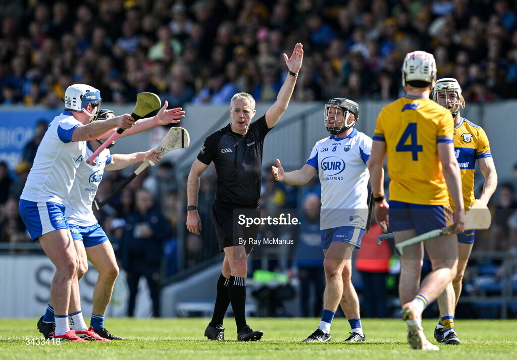 19 April 2026; Waterford players protest to Referee Shane Hynes, after he had awarded them a free,  during the Munster GAA Senior Hurling Championship Round 1 match between Clare and Waterford at Zimmer Biomet Páirc Chíosóg in Ennis, Clare. Photo by Ray McManus/Sportsfile