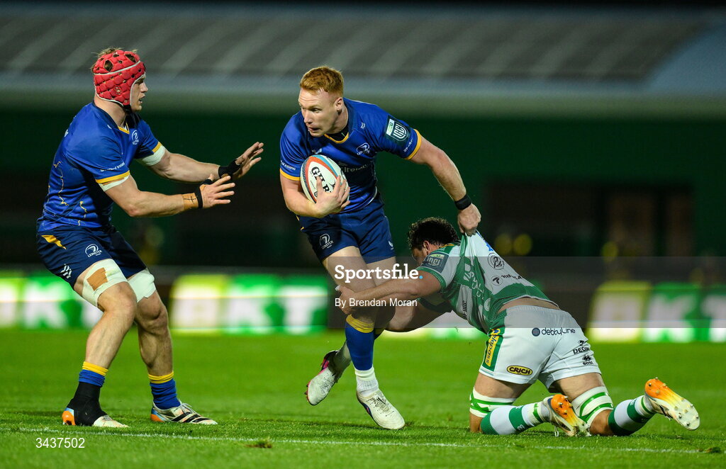 25 April 2026; Ciarán Frawley of Leinster, supported by teammate Josh van der Flier, is tackled by Michele Lamaro of Benetton during the United Rugby Championship match between Benetton and Leinster at Stadio Monigo in Treviso, Italy. Photo by Brendan Moran/Sportsfile