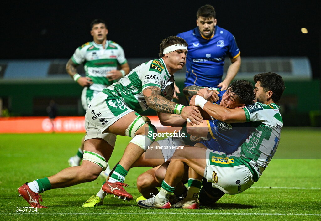 25 April 2026; Dan Sheehan of Leinster is tackled by Giulio Marini, left, and Ignacio Mendy of Benetton during the United Rugby Championship match between Benetton and Leinster at Stadio Monigo in Treviso, Italy. Photo by Brendan Moran/Sportsfile
